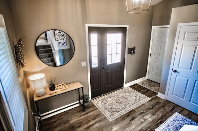 entrance foyer featuring a chandelier and dark hardwood / wood-style flooring