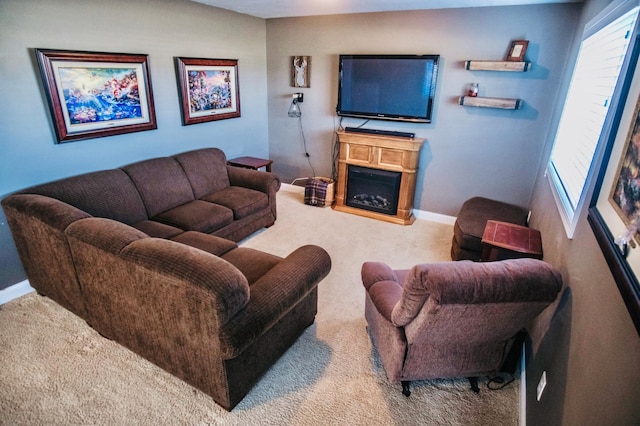 living room featuring carpet and plenty of natural light