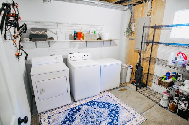 washroom featuring separate washer and dryer and electric panel