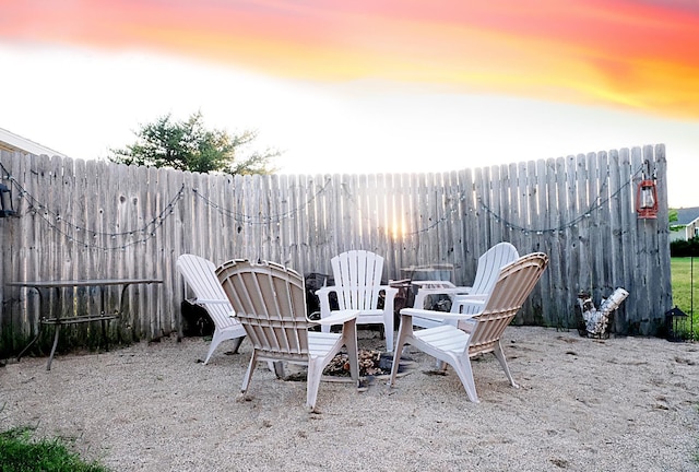 patio terrace at dusk with an outdoor fire pit