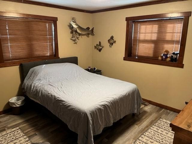 bedroom featuring light hardwood / wood-style flooring and ornamental molding