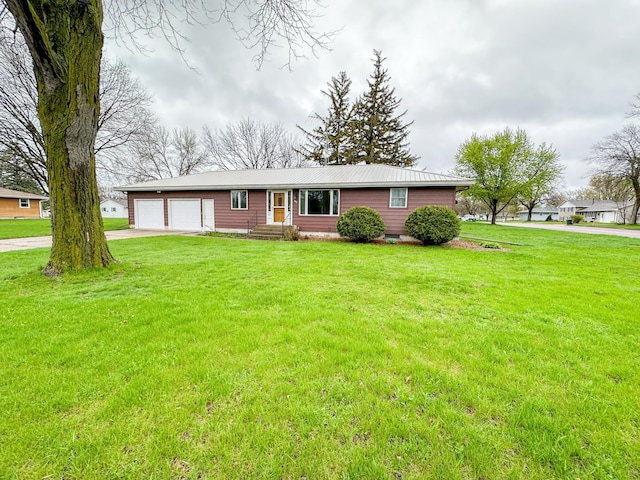 ranch-style home with a front yard and a garage