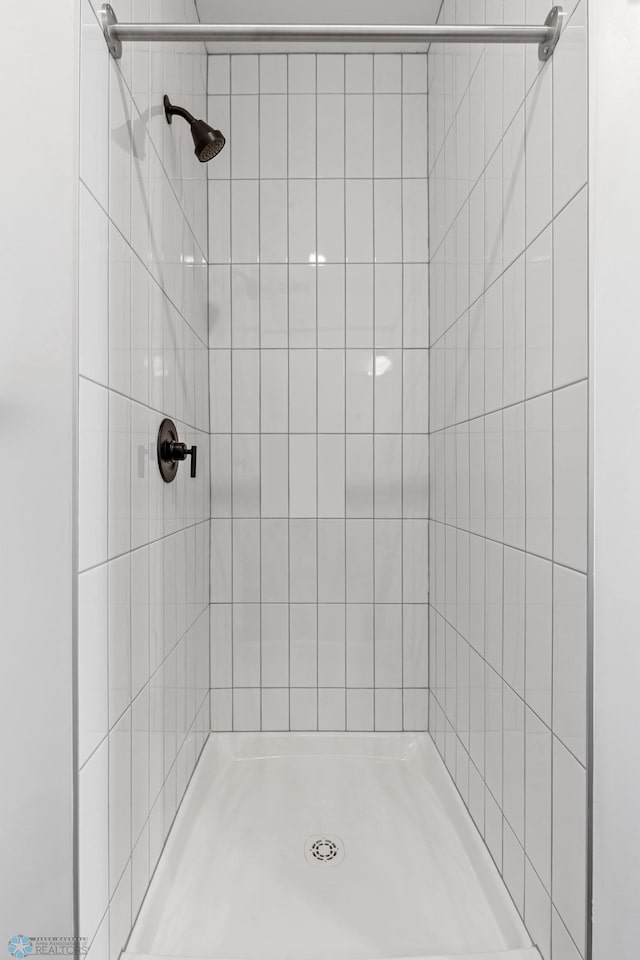 bathroom with a shower stall