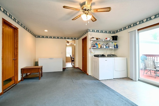 clothes washing area with carpet, ceiling fan, washer and clothes dryer, and a textured ceiling