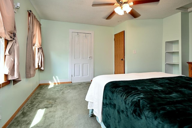 bedroom with light carpet, a closet, ceiling fan, and a textured ceiling