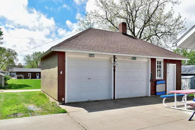 garage with a lawn