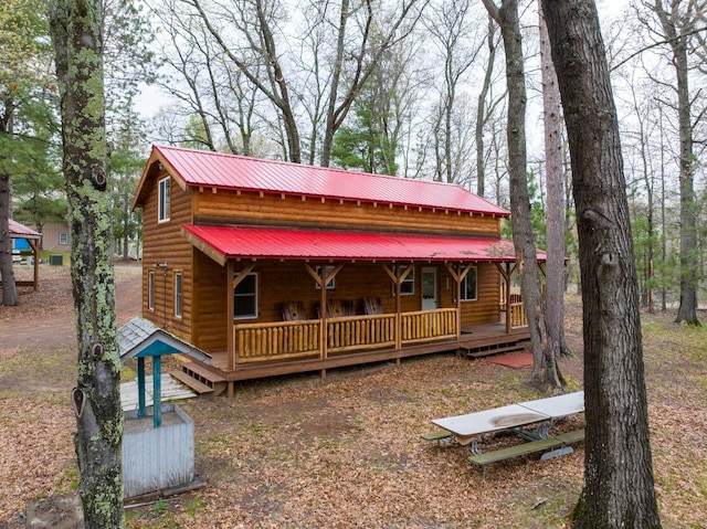 cabin featuring covered porch