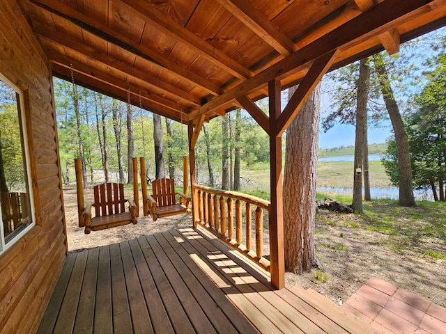 wooden deck featuring a water view