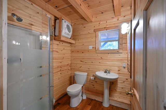 bathroom featuring wood walls, hardwood / wood-style flooring, toilet, beamed ceiling, and wood ceiling