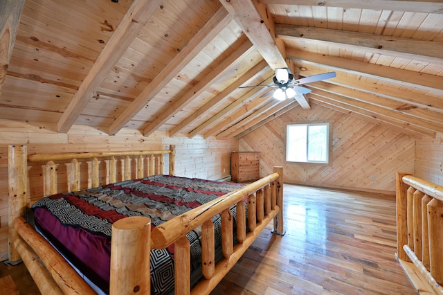 bedroom with hardwood / wood-style flooring, vaulted ceiling with beams, wood walls, and wood ceiling