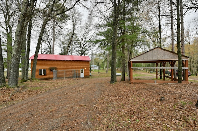 view of home's exterior featuring an outdoor structure