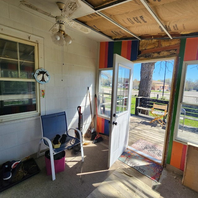 sunroom / solarium with ceiling fan