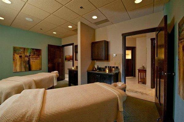 carpeted bedroom featuring a drop ceiling