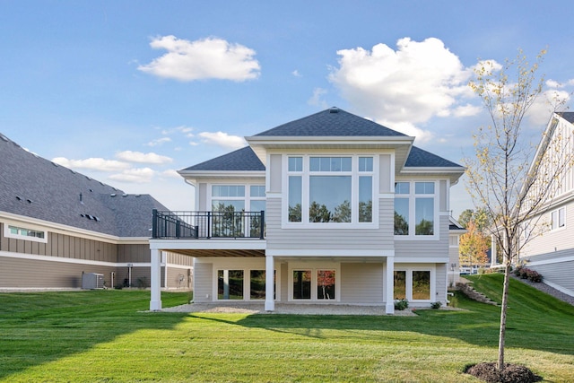 back of property featuring a deck, central AC unit, and a lawn