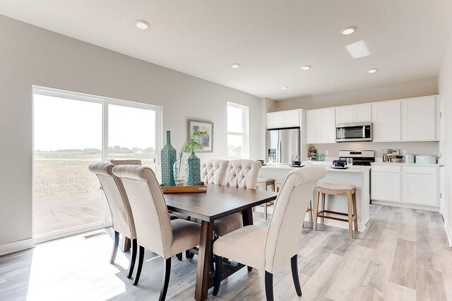 dining room with light wood-type flooring