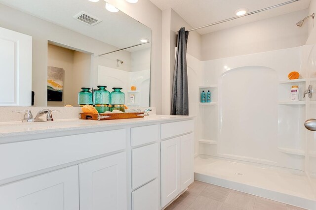 bathroom featuring vanity and a shower with curtain