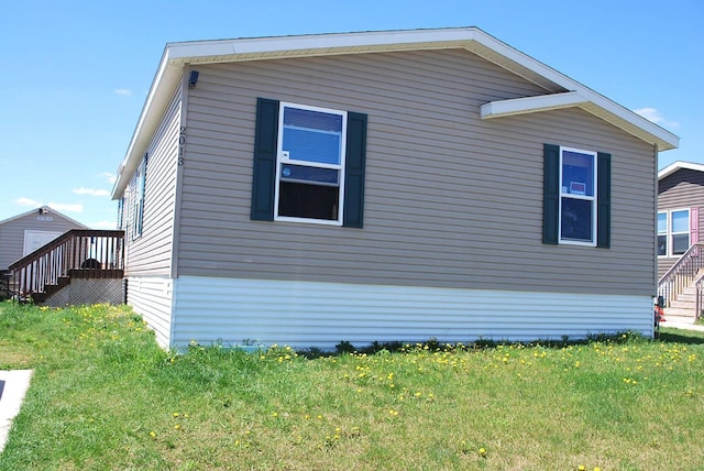 view of property exterior featuring a lawn