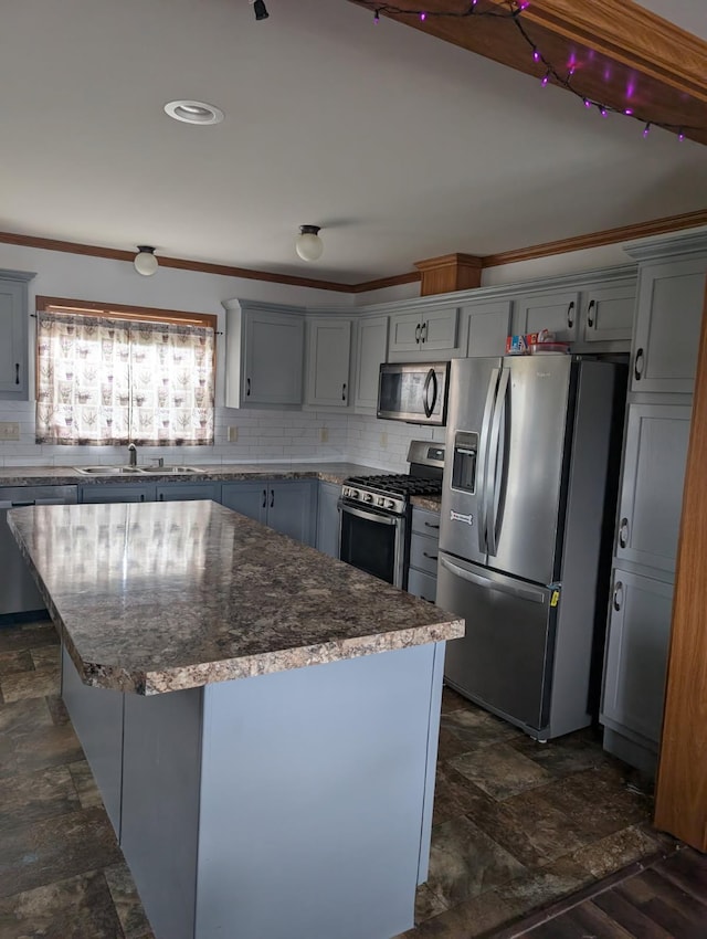 2013 Peregrine Pl NW, Stewartville, MN 55976 - kitchen featuring stone finish flooring, appliances with stainless steel finishes, a sink, and a center island