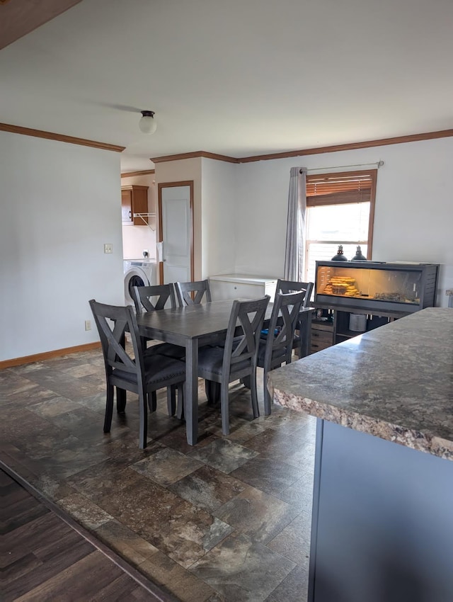2013 Peregrine Pl NW, Stewartville, MN 55976 - dining room featuring ornamental molding, washer / clothes dryer, and stone finish floor