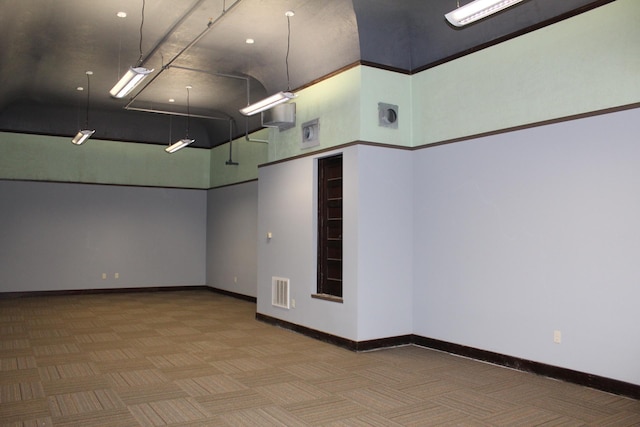 empty room with parquet floors and a high ceiling