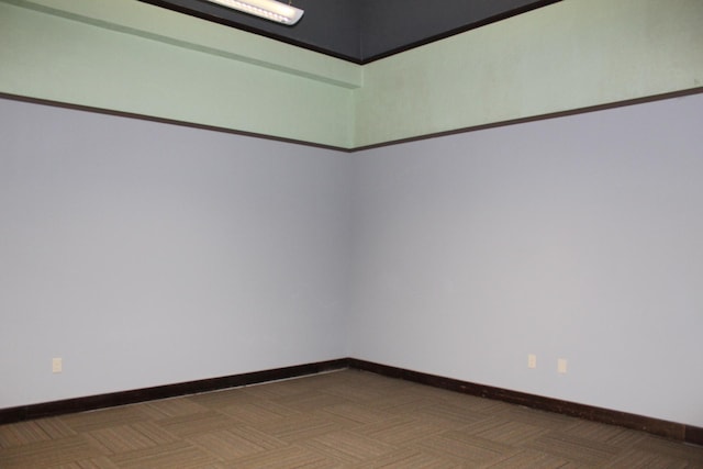 empty room with dark parquet floors