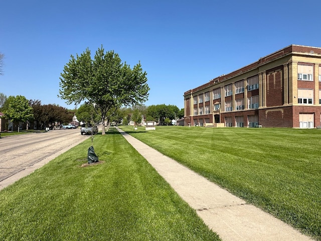 surrounding community featuring a lawn