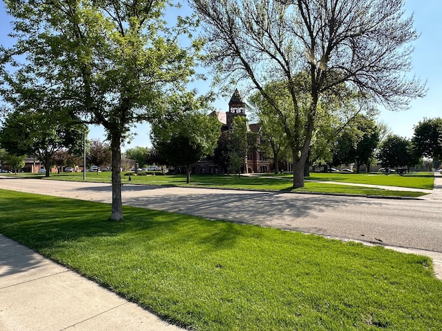 view of community featuring a yard