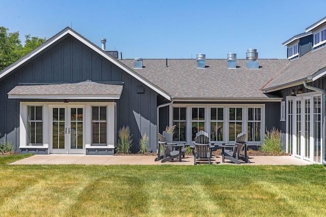 back of house with a patio area, french doors, and a yard