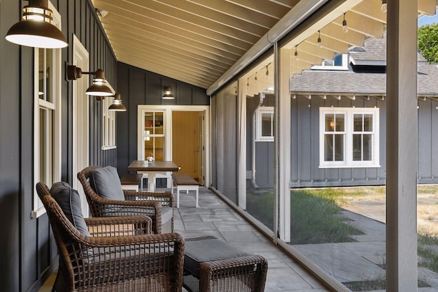 sunroom / solarium with vaulted ceiling