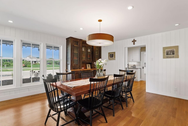 dining area with plenty of natural light and light hardwood / wood-style floors