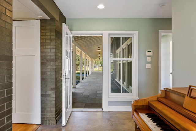 doorway with concrete flooring