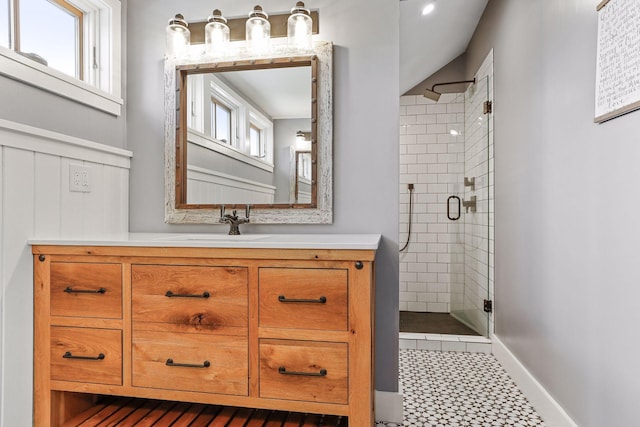 bathroom featuring walk in shower, tile flooring, and vanity