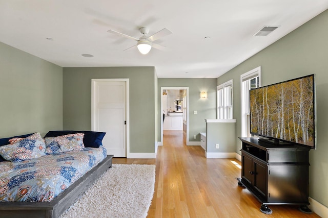 bedroom featuring ceiling fan and light wood-type flooring