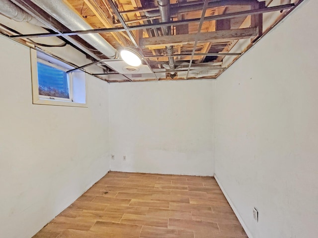 basement featuring light hardwood / wood-style flooring