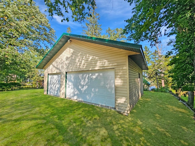 garage with a lawn