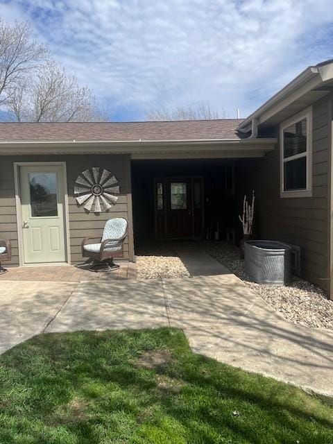 rear view of property featuring a patio