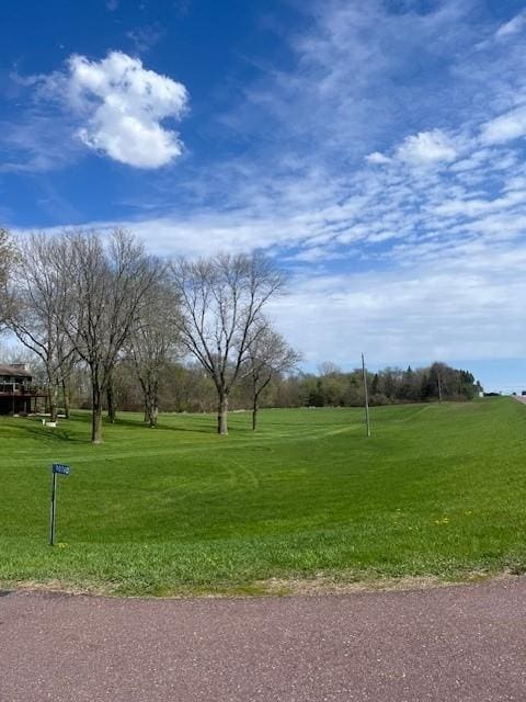 view of property's community with a lawn