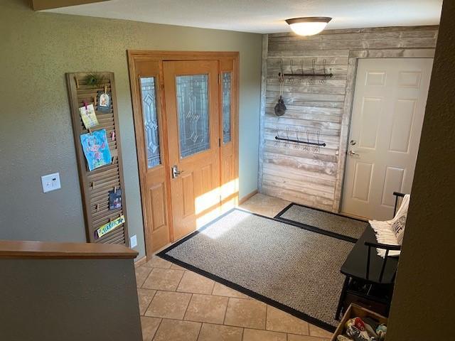 entrance foyer with light tile floors