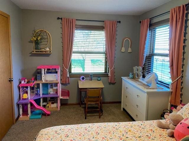 bedroom featuring carpet flooring and multiple windows
