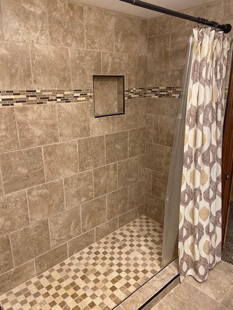 bathroom with a shower with shower curtain