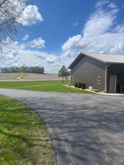 view of side of property featuring a yard