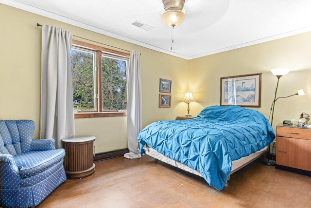 bedroom with wood-type flooring, ceiling fan, and crown molding