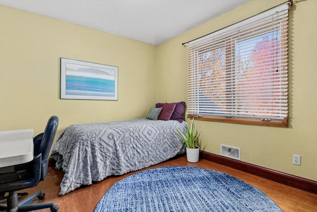 bedroom featuring a textured ceiling