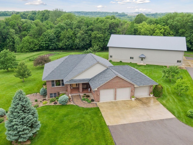 view of front of house featuring a garage and a front lawn