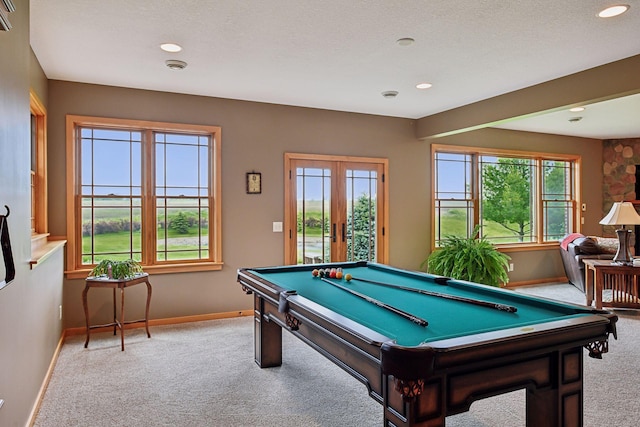 playroom featuring a textured ceiling, billiards, and carpet flooring