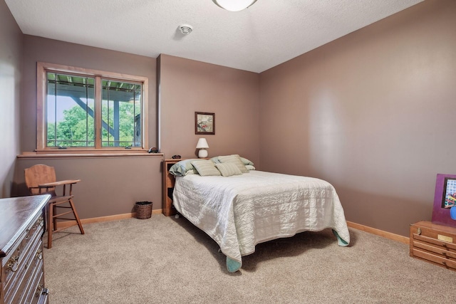 carpeted bedroom with a textured ceiling