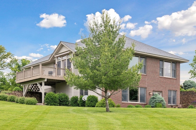 exterior space with a wooden deck and a yard