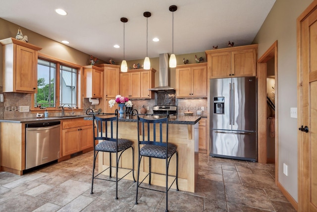 kitchen featuring decorative backsplash, wall chimney exhaust hood, a center island, and stainless steel appliances