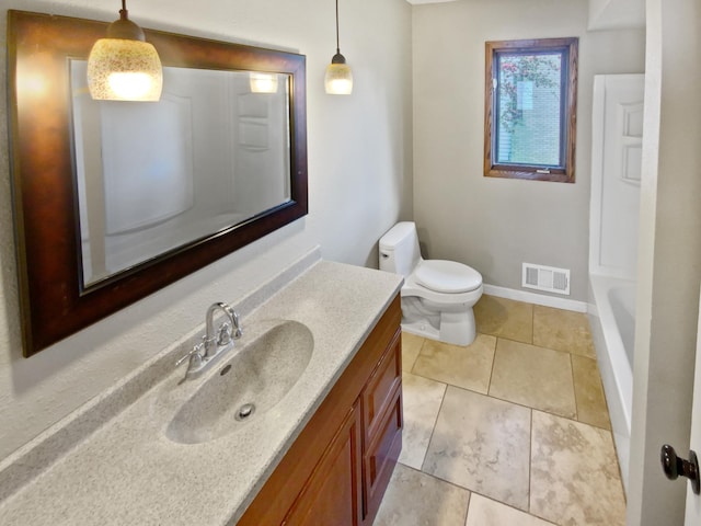 bathroom with tile patterned flooring, vanity, a bath, and toilet