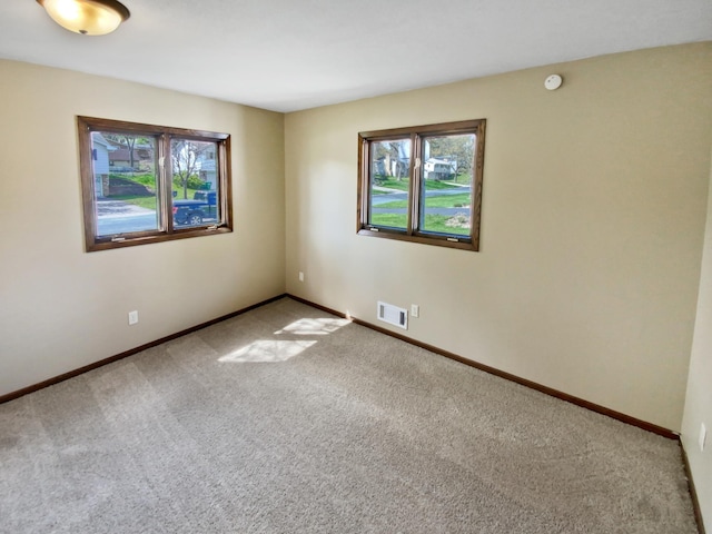 unfurnished room featuring carpet floors